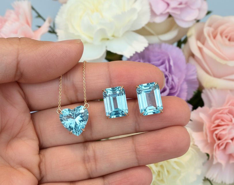 Aritos en oro de 14k, topacios naturales en corte Esmeralda, pin y mariposa