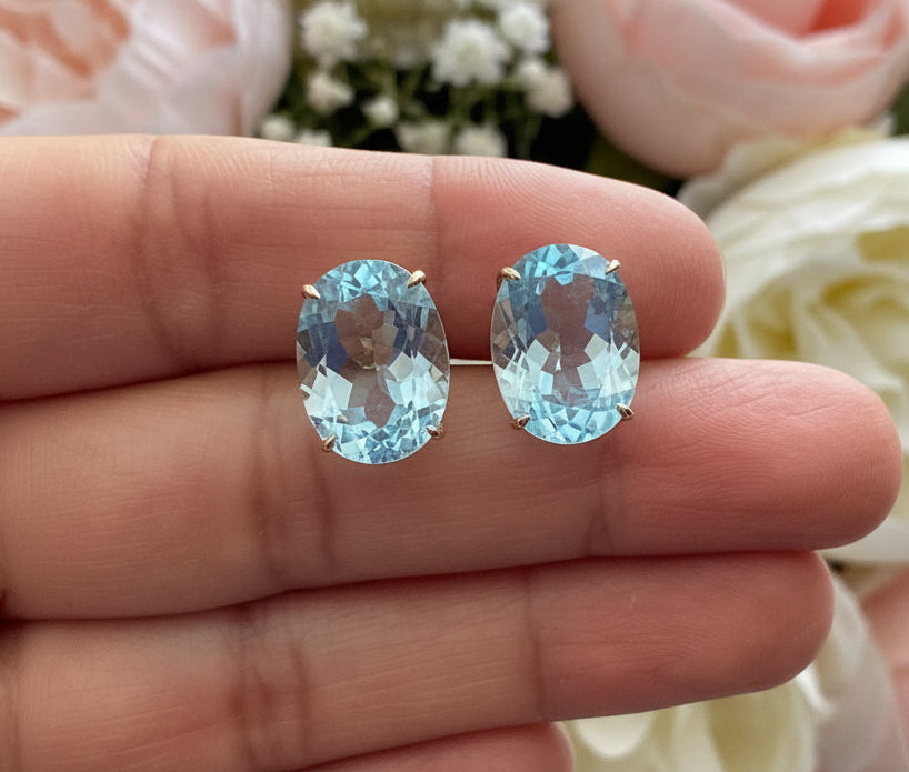Aritos en oro de 14k, Topacio Sky Blue natural