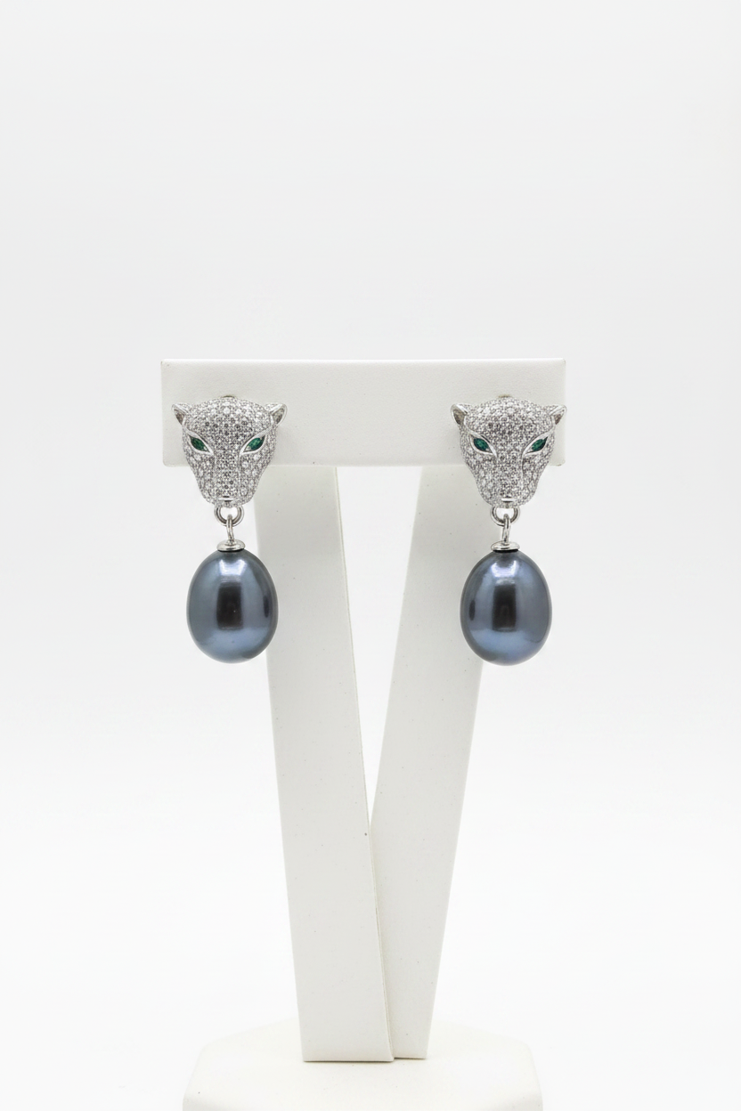 Aretes con cara de jaguar y Perlas naturales de río negras